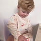 Over the Dandelions Waterproof Longsleeve Bib Dinosaur
